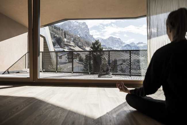 glass window and terrace overlooking the mountain panorama